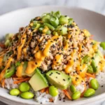 Bang Bang Ground Turkey Rice Bowl served with fresh vegetables and spicy sauce