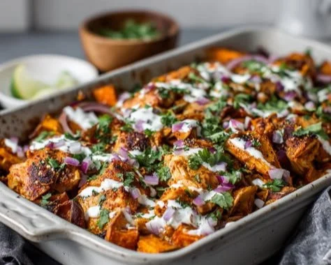 Buffalo Chicken Sweet Potato Bowl garnished with green onions and blue cheese