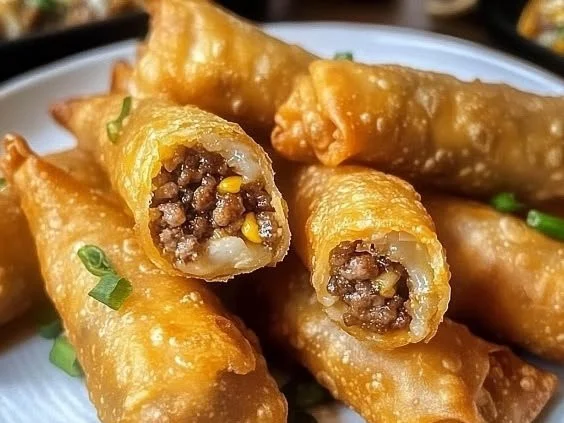 Plate of cheeseburger eggrolls with dipping sauce