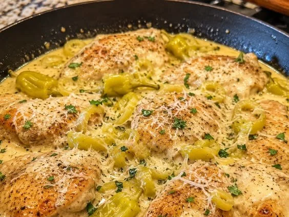 Creamy Pepperoncini Chicken served on a plate with herbs and spices