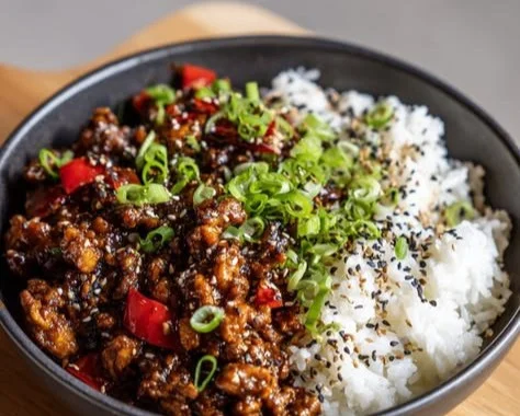 Firecracker Ground Chicken dish garnished with herbs on a plate