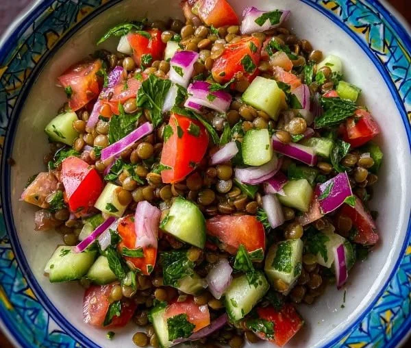 Healthy and colorful Lentil Salad with fresh vegetables and spices