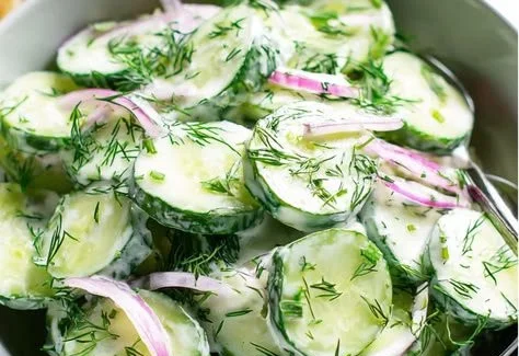 Delicious cucumber dill salad in a bowl, garnished and ready to serve.