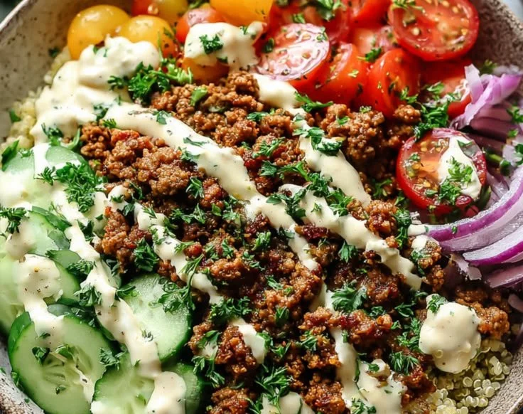 Mediterranean Ground Turkey Bowl topped with fresh vegetables and garnishes