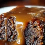 Deliciously moist gooey sticky toffee pudding served on a plate