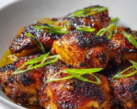 Savory miso chicken thighs served with vegetables on a plate