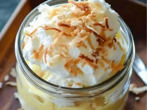 Toasted coconut cream pudding topped with shredded coconut.